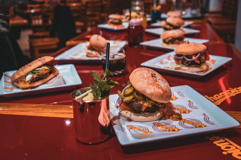 Featured image for article: 7 Droolworthy Burgers You Need to Try ASAP from Munich's Champions Sportsbar