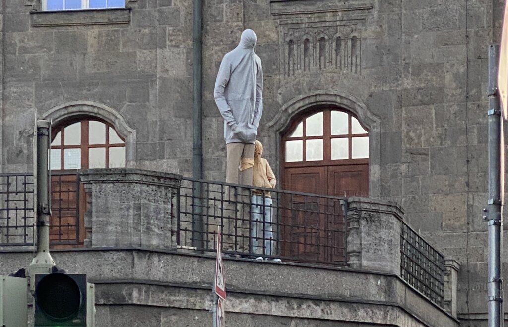 Creepy Hoodie Statues Near Munich Hauptbahnhof: WTF Are They, Actually?